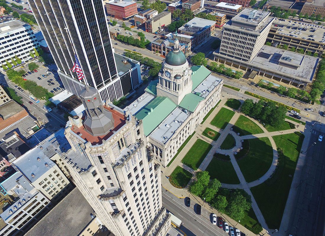 Contact - Aerial View of Fort Wayne Downtown Iconic Buildings Architecture on a Sunny Day